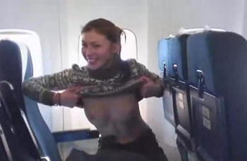 Girl flashing tits in plane <!-- width=