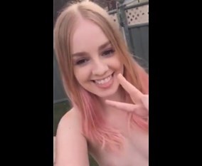 Naked girl on garden selfshot rubbing pussy