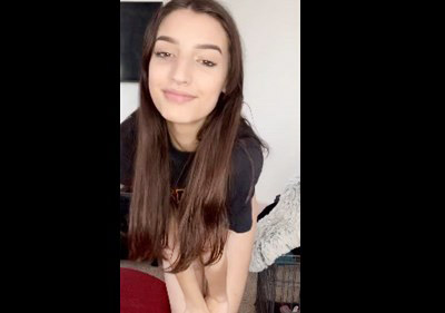 Cute brunette shows her firm tits and spread ass