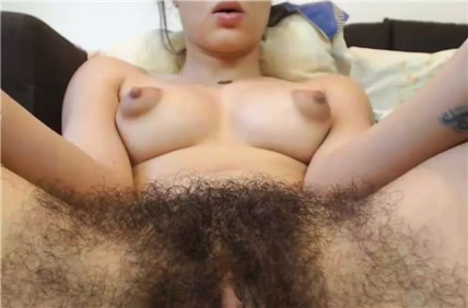 Teen shows her hairy pussy and firm tits with puffy nipples