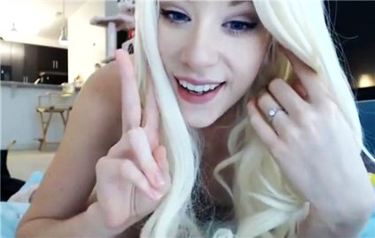 Platinum blonde plays with toy on cam