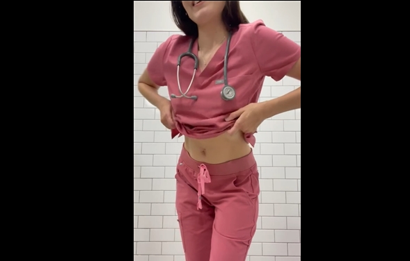 Sexy nurse without bra <!-- width=