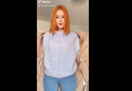 Sexy redhead teases on TikTok <!-- width=