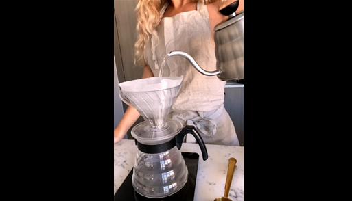 Slender blonde shows TikTok trick with coffee <!-- width=