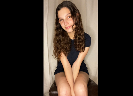 Cute curly brunette teases without underwear  <!-- width=