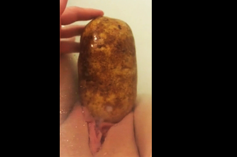 Girl masturbates with potato in bath <!-- width=