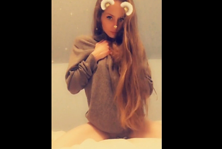Kitty teases in sweater and socks
