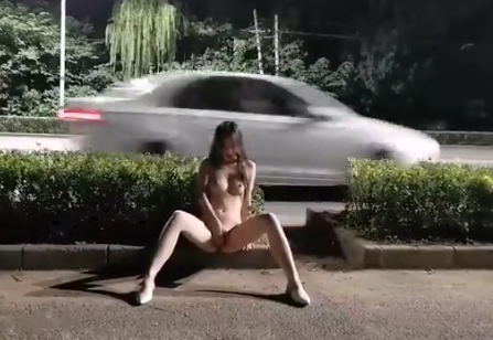 Naked girl rubs pussy on evening street <!-- width=