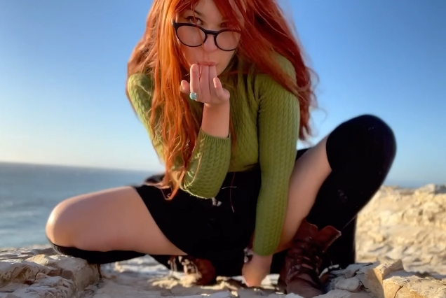 Redhead OliveWood playing with a dildo by the sea