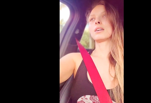 Blonde Layna Landry rubs her pussy while driving