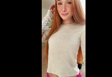 Petite redhead shows a little dance