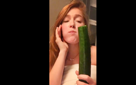 Girl Jia Lissa plays with huge cucumber