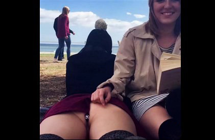 Two girls outdoors with anal plug and book <!-- width=