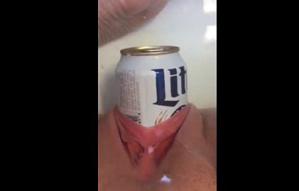 With beer bottle in the bath