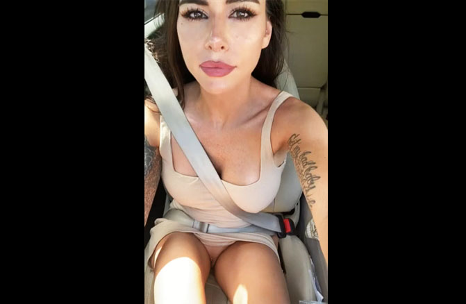 Sexy brunette toying in her car