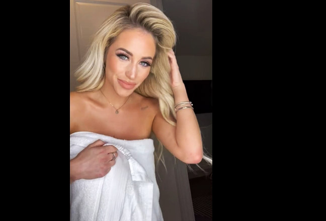 Blonde teases with towel in the bathroom