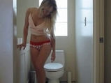 Blonde filmed stripping and masturbation in bathroom