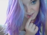Girl with purple hair stimulates mini vibrator pussy