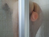 Girl fucks wall dildo in shower