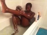 Black girl washes in bath
