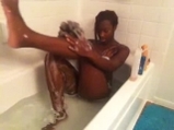 Black girl washes in bath <!-- width=