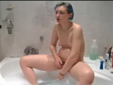 Blue haired girl masturbates in bathtube