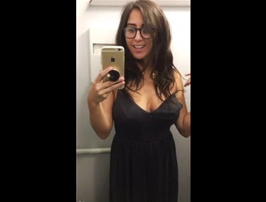 Busty brunette strips in an airplane toilet