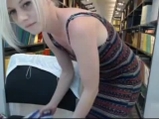 Blonde babe undressing in the public library <!-- width=